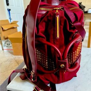 Caraa Oxblood Sudio Bag with gold studded hardware